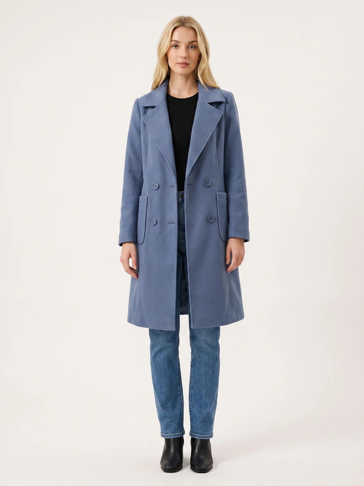 The Dusty Blue wool-blend coat worn open on a model, photographed from the front in a studio
