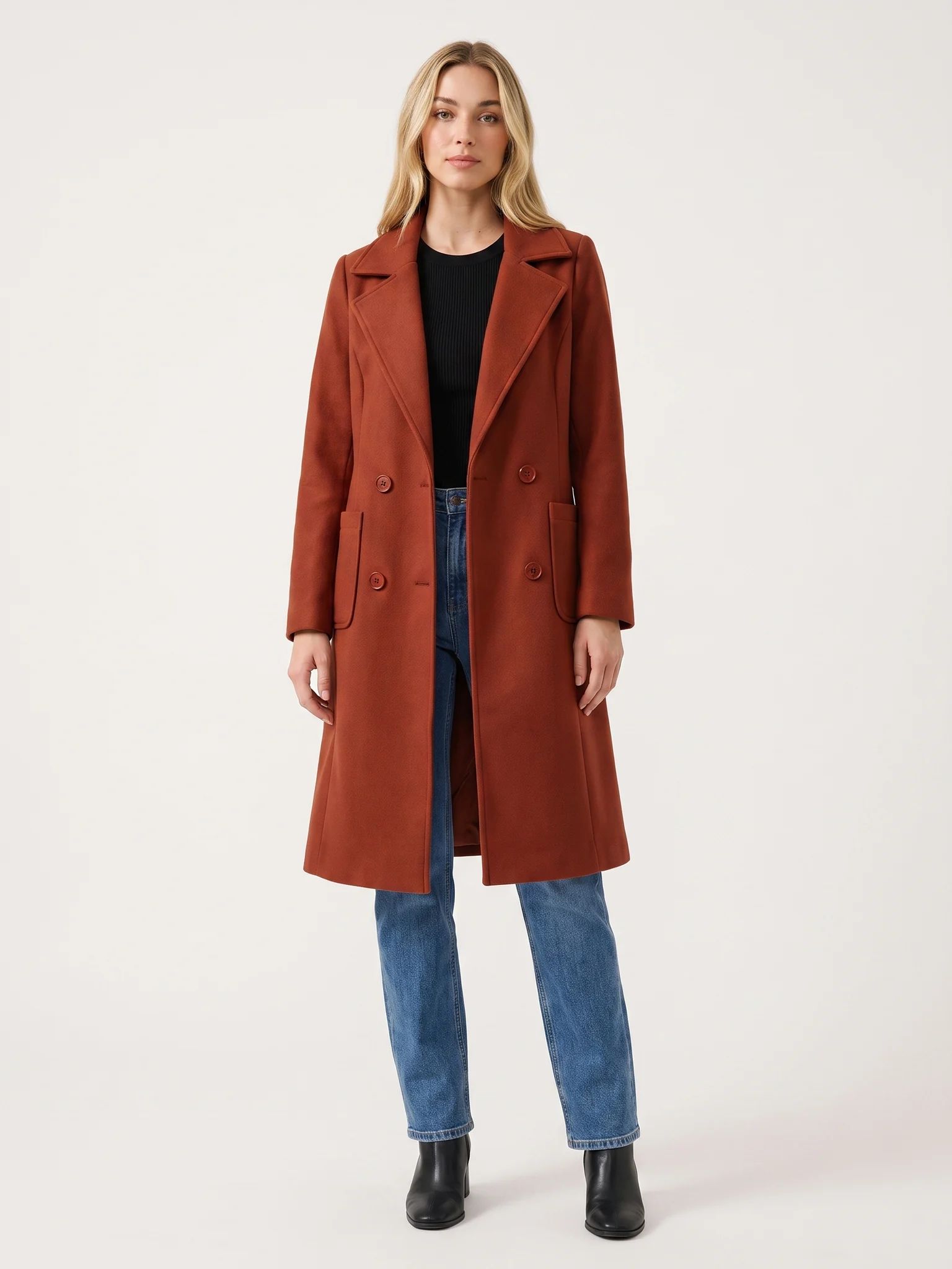 The Rust wool-blend coat worn open on a model, photographed from the front in a studio