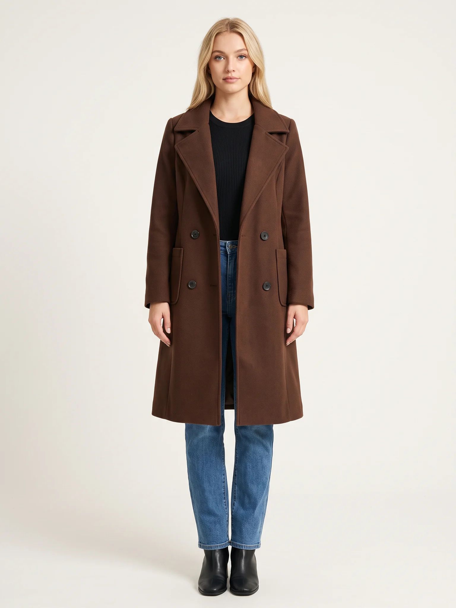 The Chocolate wool-blend coat worn open on a model, photographed from the front in a studio