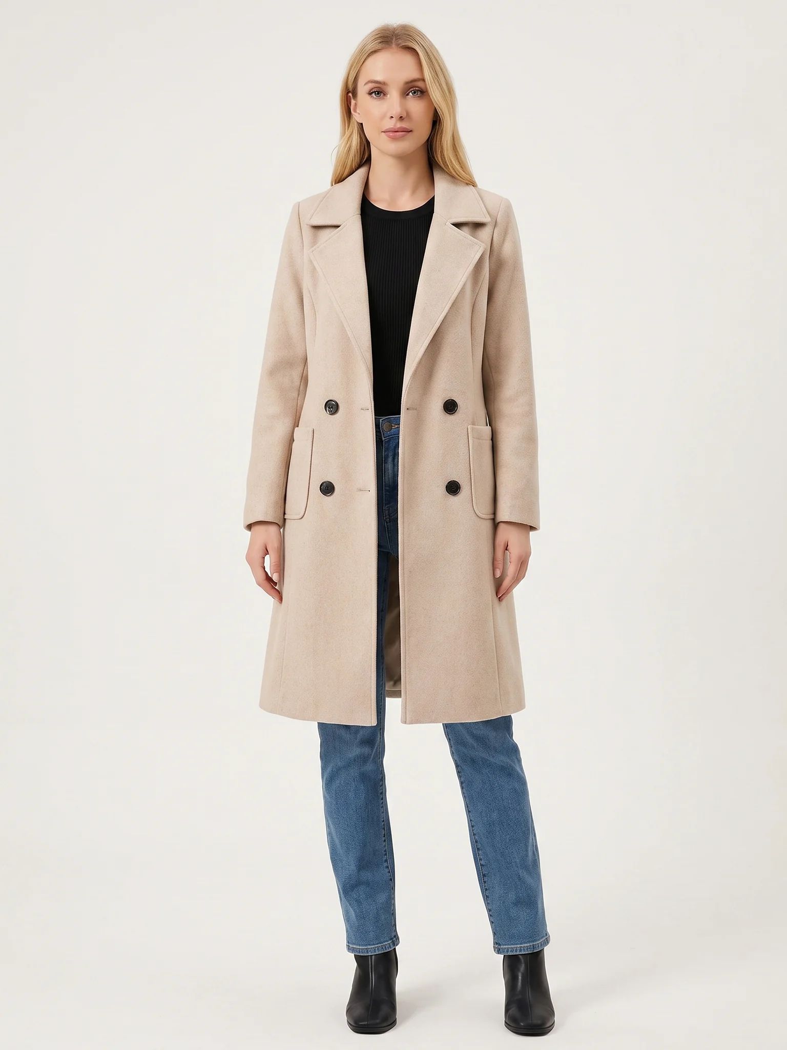 The Sand wool-blend coat worn open on a model, photographed from the front in a studio