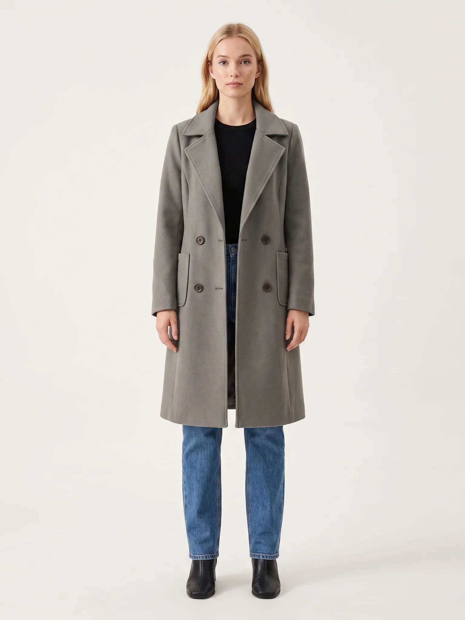 The Grey wool-blend coat worn open on a model, photographed from the front in a studio