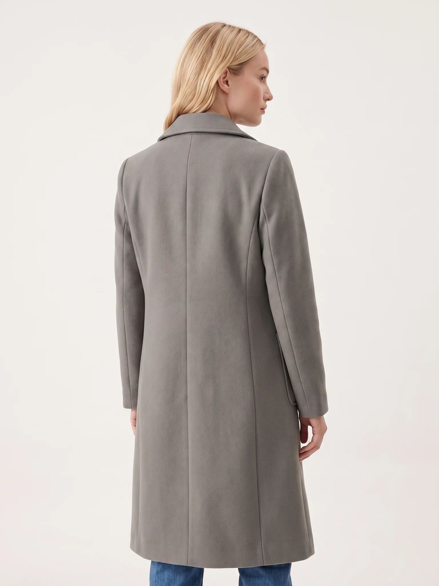 The back of the Grey wool-blend coat on a model, showing the shoulder line and the below-the-knee hem