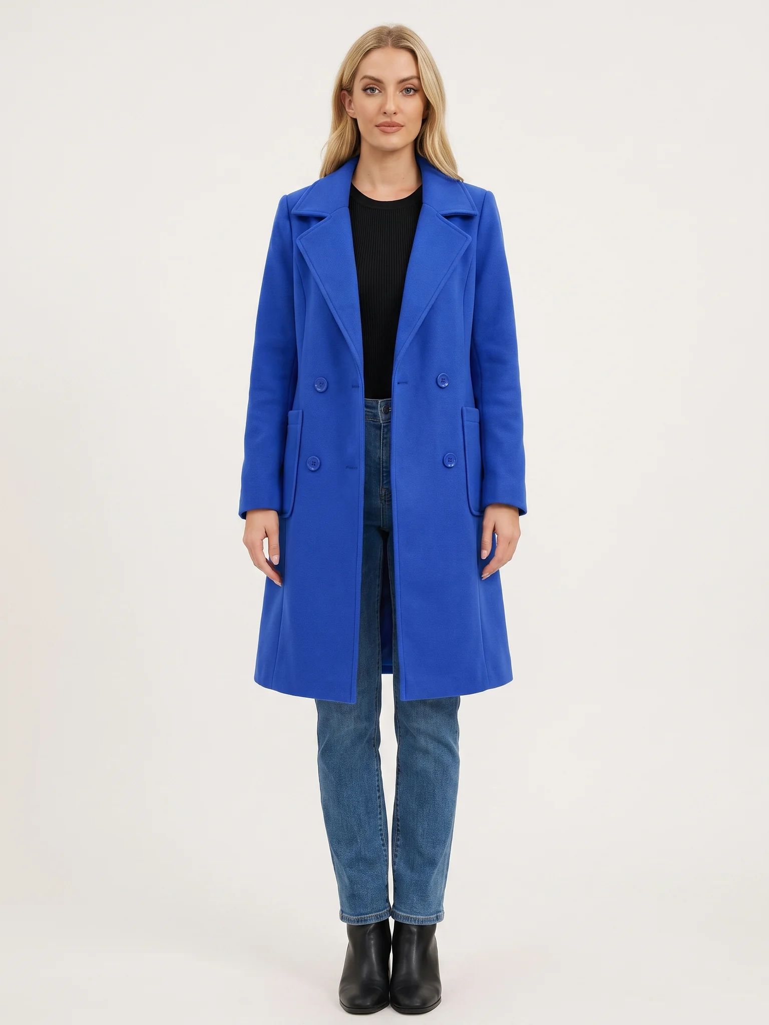 The Klein Blue wool-blend coat worn open on a model, photographed from the front in a studio