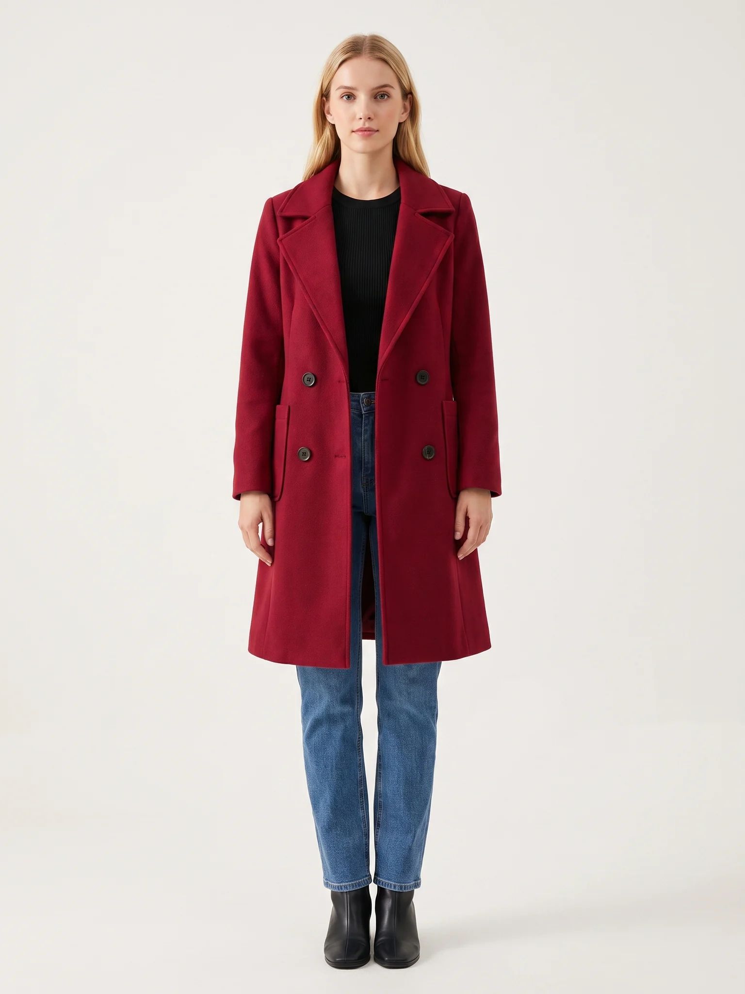 The Crimson wool-blend coat worn open on a model, photographed from the front in a studio