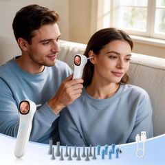 One person checking another’s ear at home with the full accessory set and charging cable
