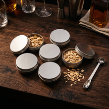 Six wood-chip flavour tins with a measuring spoon