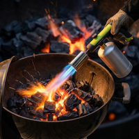Flame torch firing into BBQ charcoal