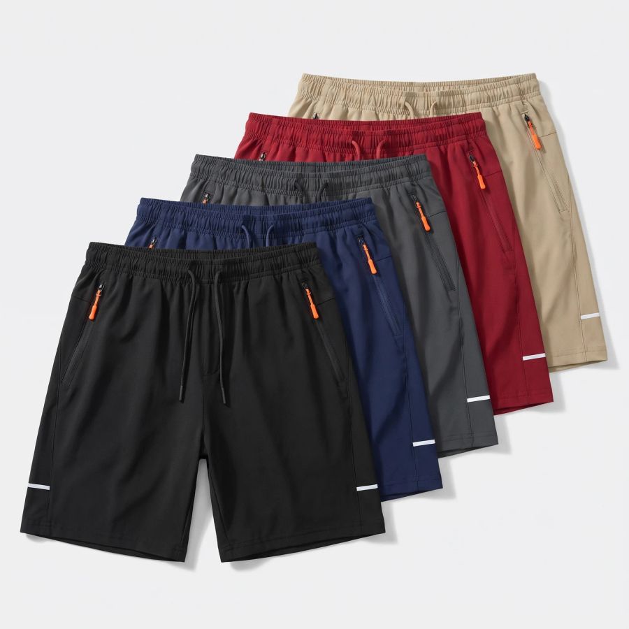 Five pairs of Flex Fit training shorts fanned out in black, navy, dark gray, red and khaki