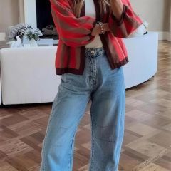 Red cardigan worn with wide-leg jeans