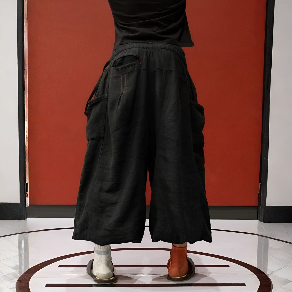 Woman wearing the flax pants in a natural setting
