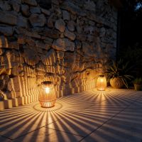 Rattan lantern casting warm shadows on a table