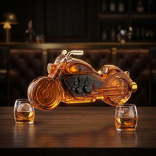 Motorcycle whiskey decanter and two glasses on a dark home bar