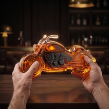 The decanter held in two hands, showing its size
