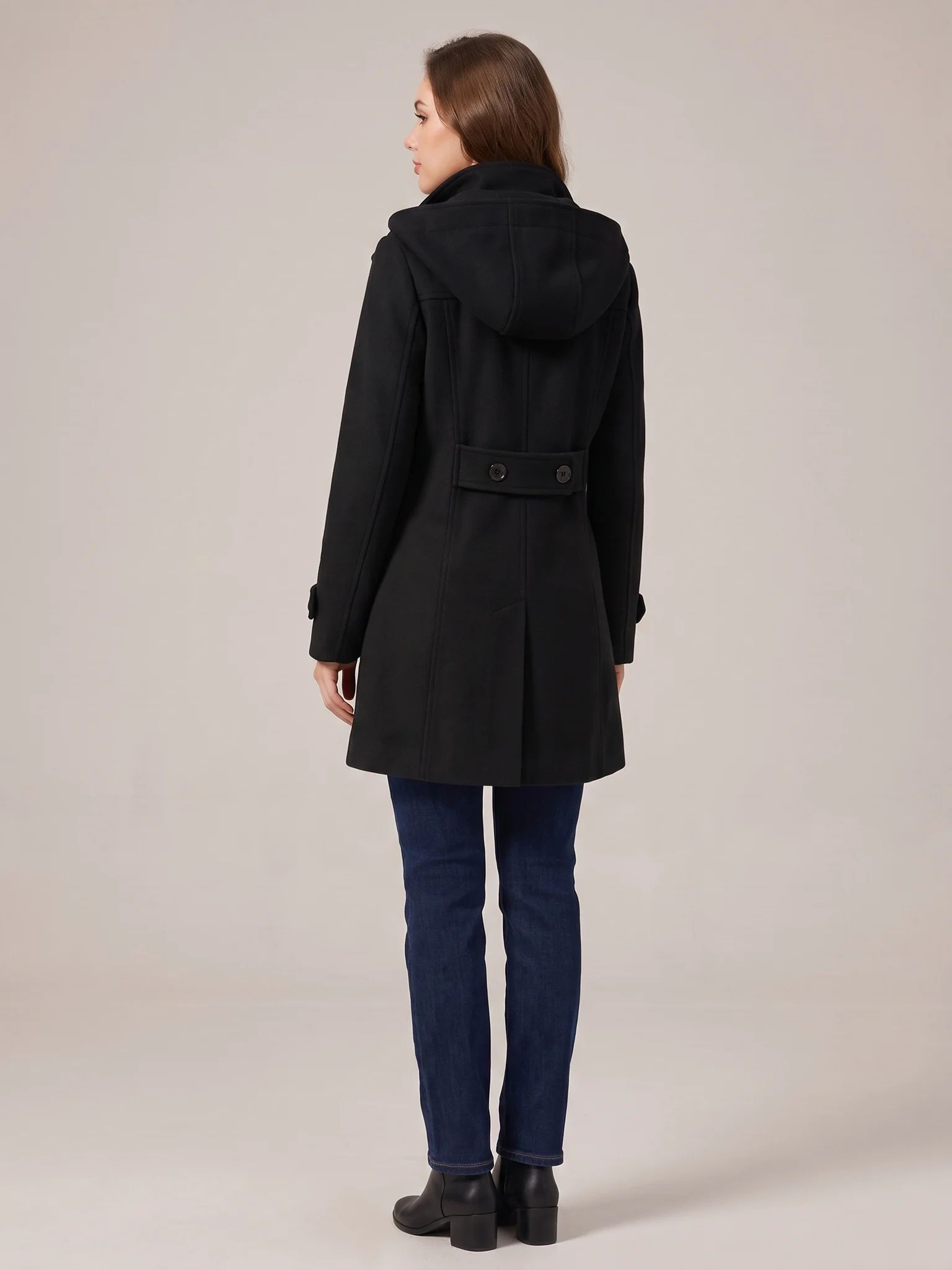 Back of the Black hooded wool pea coat with the hood up, showing the buttoned waist tab and back vent